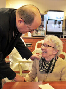 Bishop Walkowiak greets Sister Patrice during a visit to the Dominican Center (Feb. 2020 by Jade Meyer)