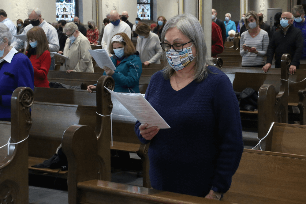 Cathedral congregation at Mass wearing masks, social distancing
