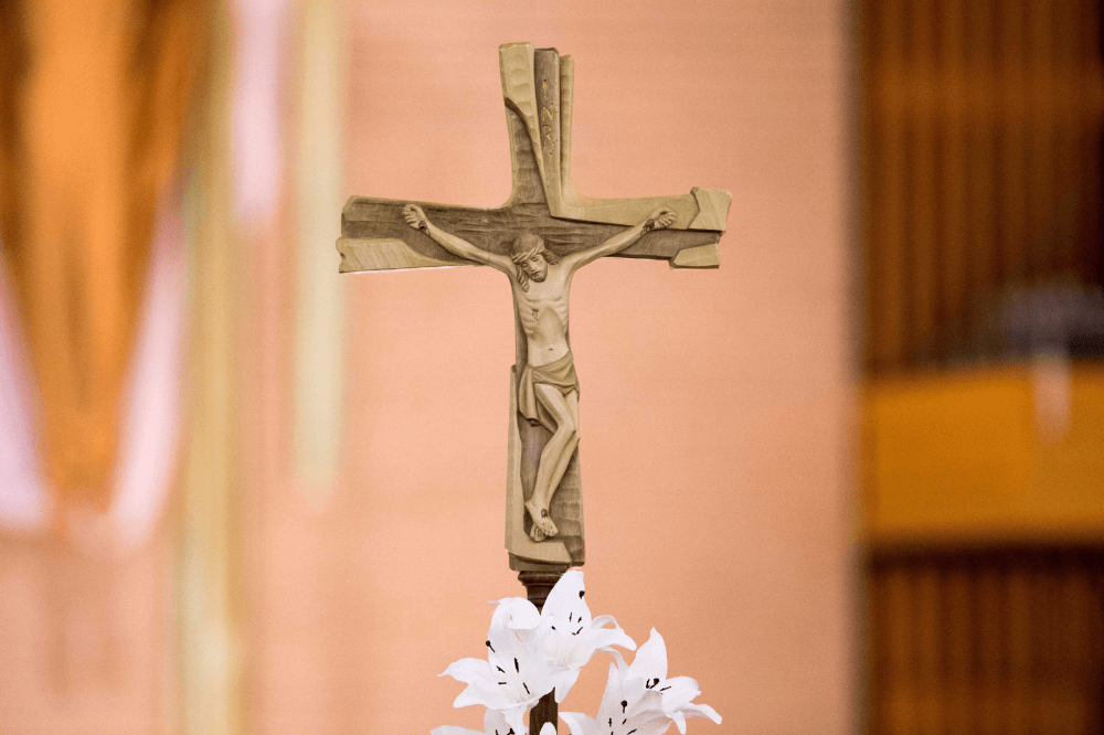 Image of a crucifix and white lilies