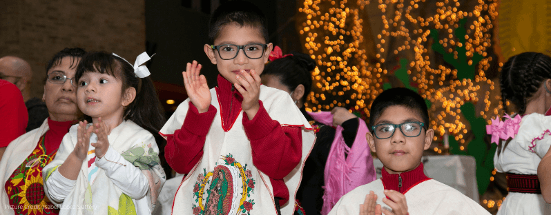 Young children sing along during Our Lady of Guadalupe mass at the Shrine of SFX & OLG