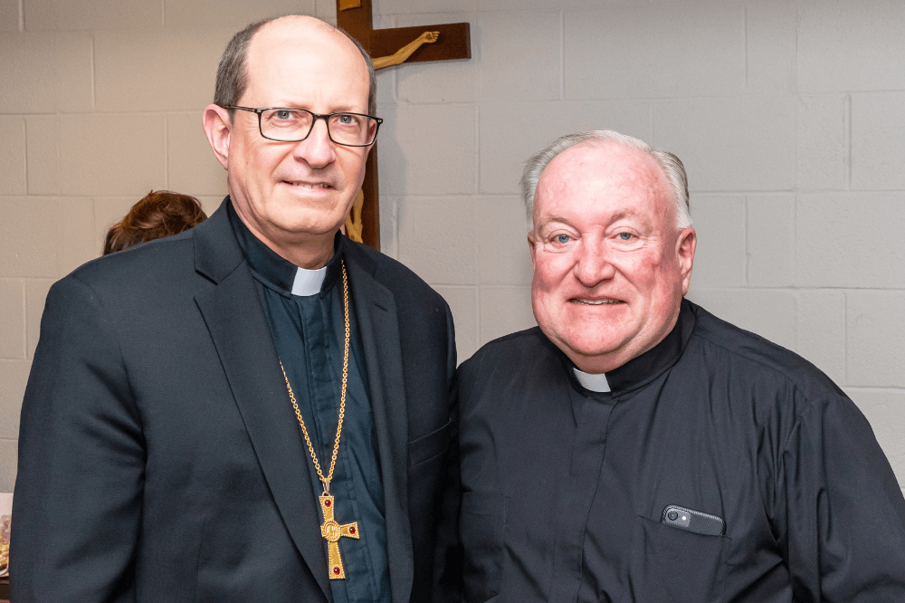 Bishop Walkowiak and Monsignor Duncan at feast day celebration for St. Sebastian Parish, Jan. 2019
