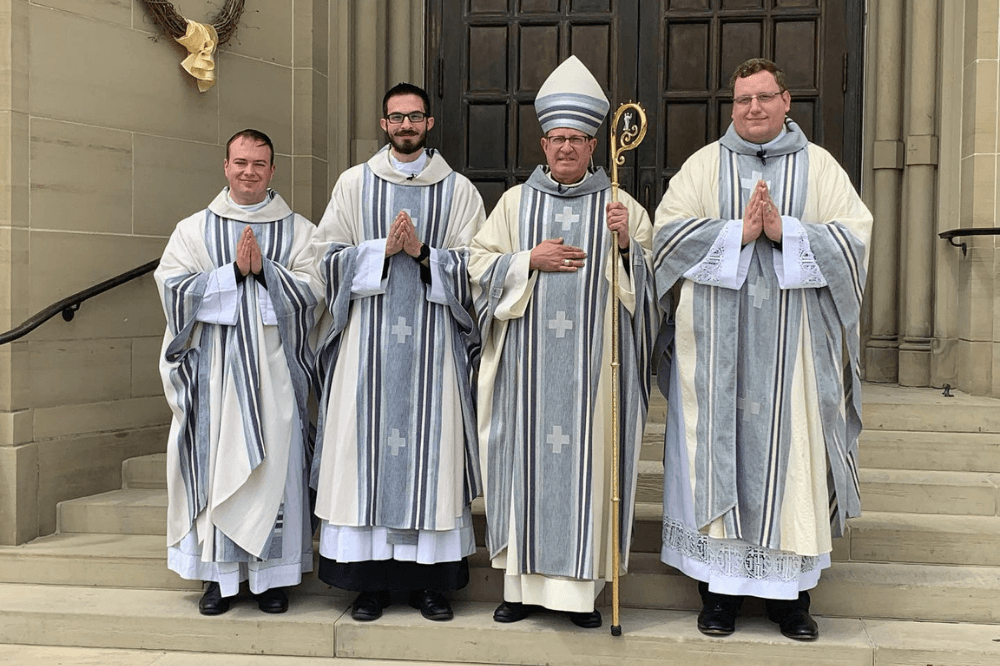 Photo of Bishop Walkowiak and Father Sacha, Father Logan and Father Jameson following ordination Mass June 4, 2022