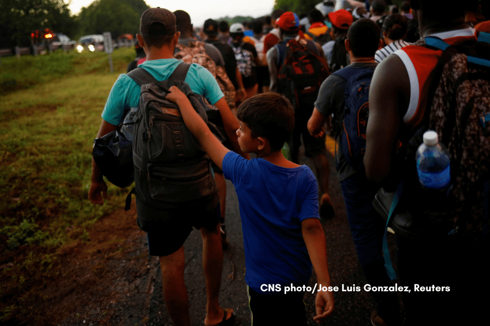 Xabiel, 9, a migrant from Venezuela, walks with his brother, Yilber Gabriel, as they join a caravan near Villa Comaltitlán, Mexico, heading to the U.S. border Nov. 20, 2021. (CNS photo/Jose Luis Gonzalez, Reuters)