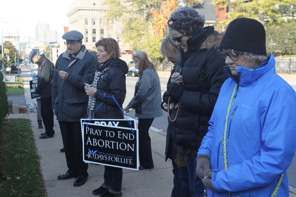 Bishop Walkowiak joins others outside Heritage Clinic to pray for an end to abortion.