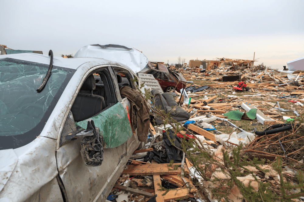Smashed cars and homes in aftermath of tornado