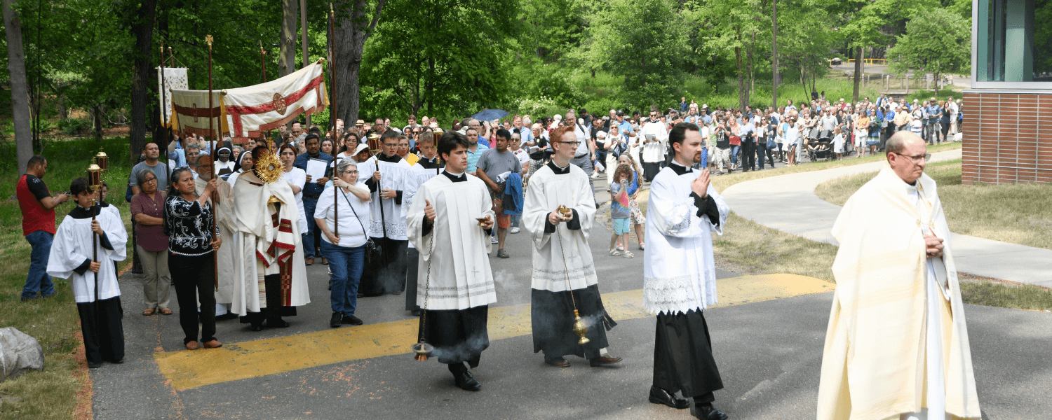 Eucharistic procession during Into the Mystery June 10, 2023 on the campus of Aquinas College, by Jaymie Perry