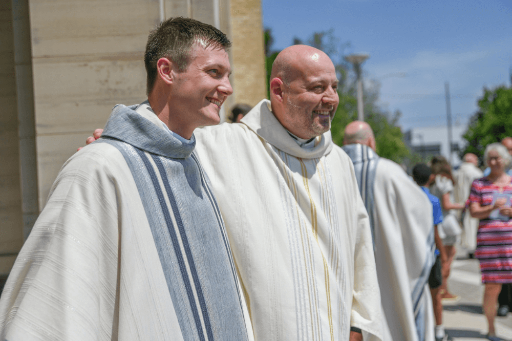 Father Jacob Zemaitis and Father Peter Damian outside the Cathedral of Saint Andrew following ordination Mass June 2023 by Jaymie Perry.